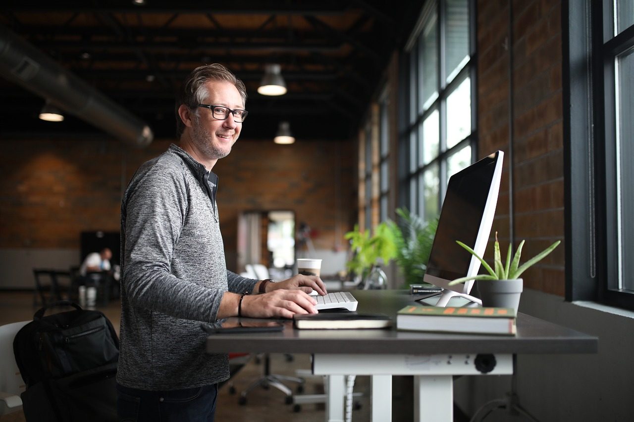 Darksn Go developer smiling at his workspace