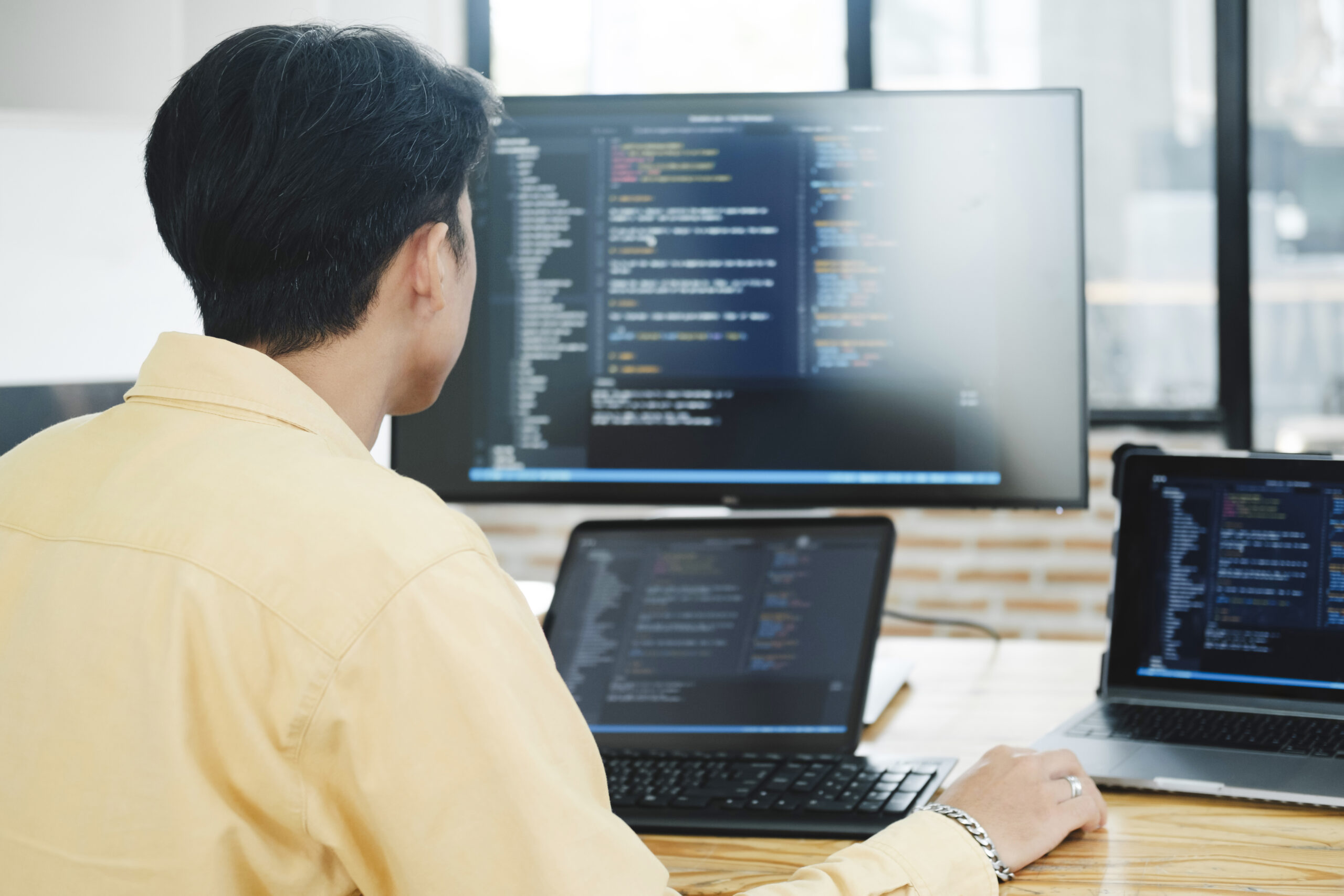 IT Programmer Starts Working on Desktop Computer. The Website Developer, Software Engineer Developing App, Video Game. Terminal with Coding Programming Language.